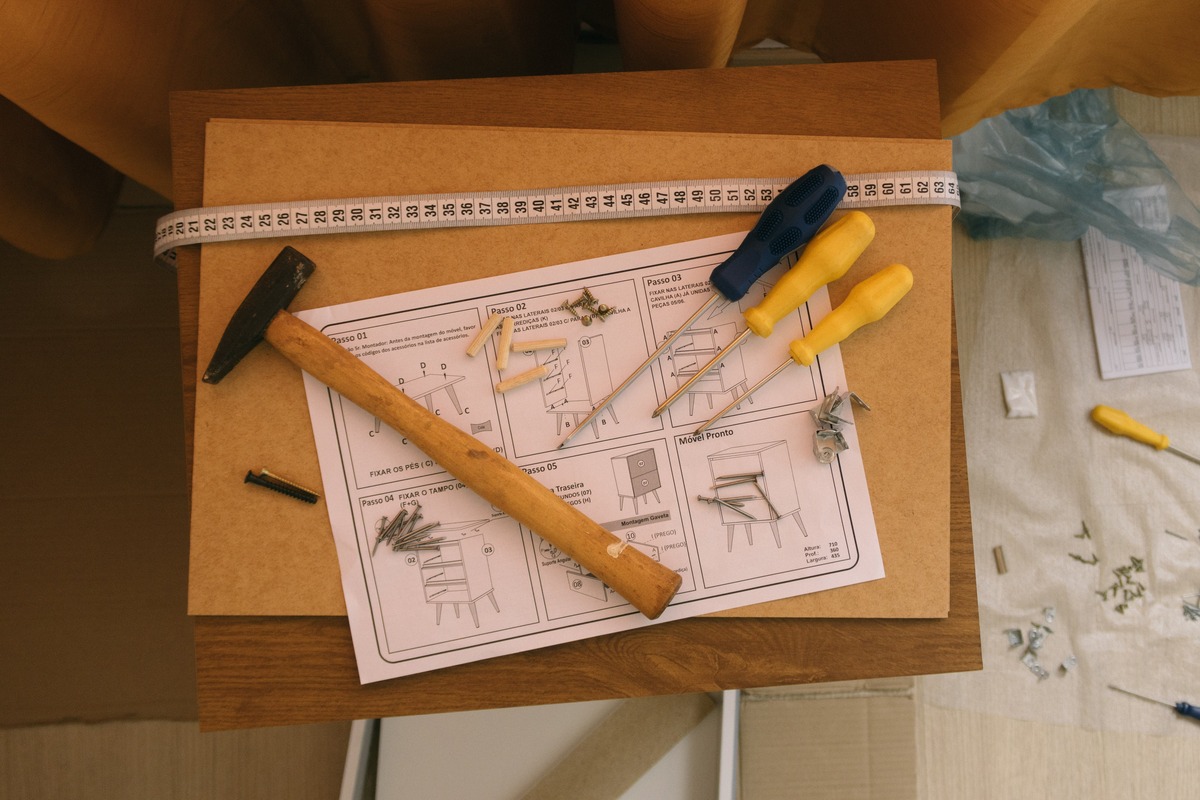 A work table with tools and plans